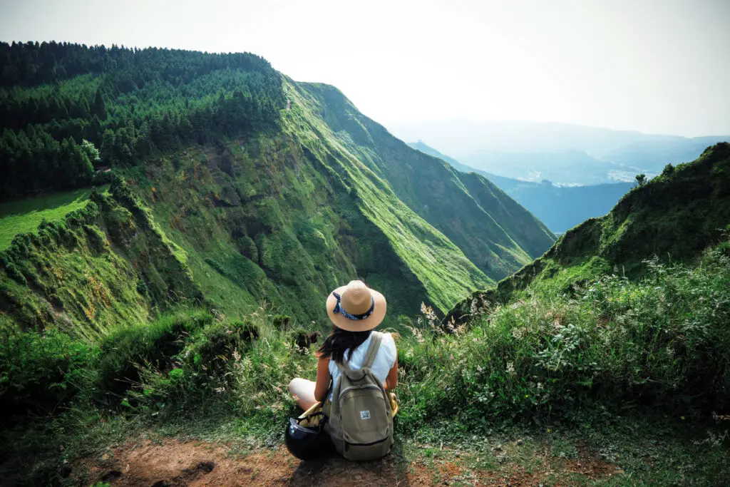 solo female traveler on a mountain, adventure seeker
