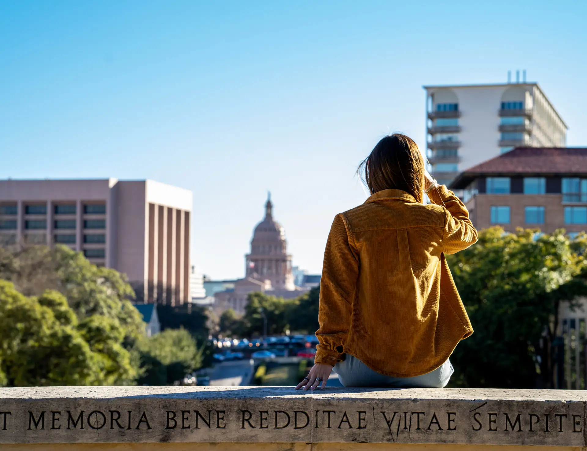 Solo female traveler gazing at the skyline in downtown Austin