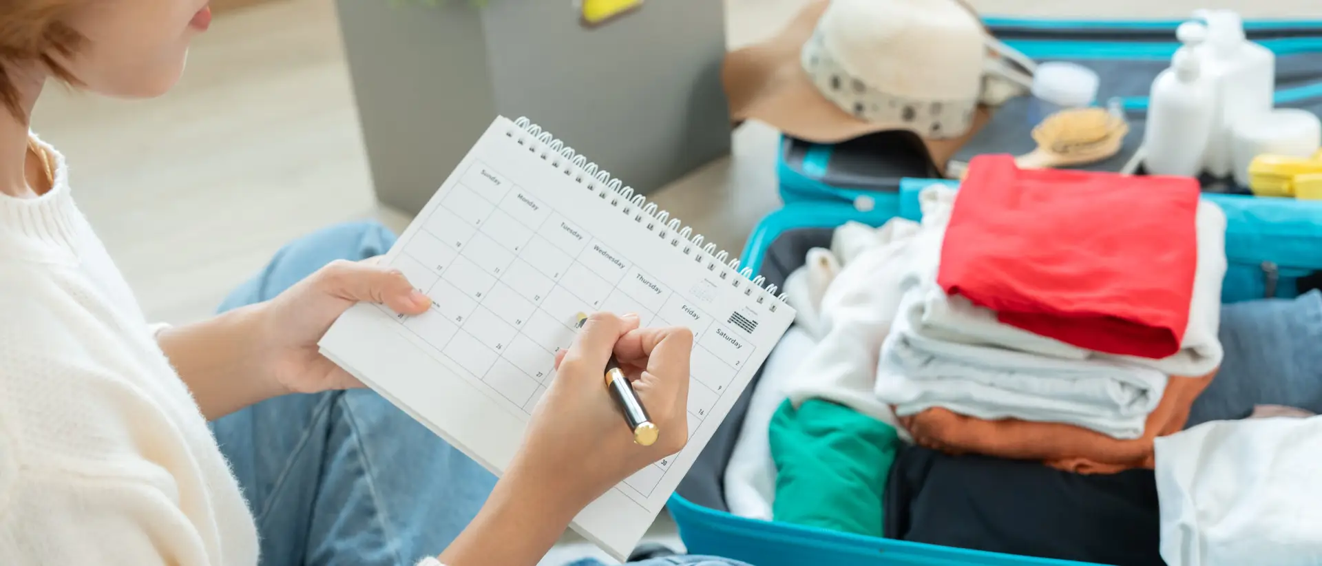 Holiday travel planning with travel calendar and luggage
