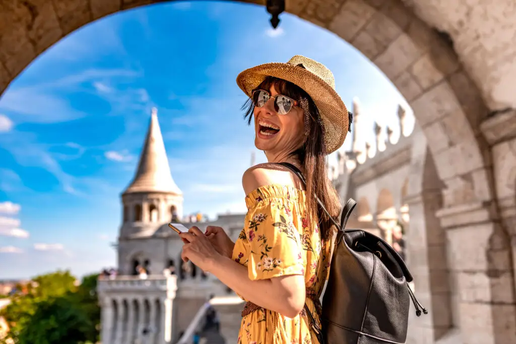 Girl outside of a castle while traveling solo