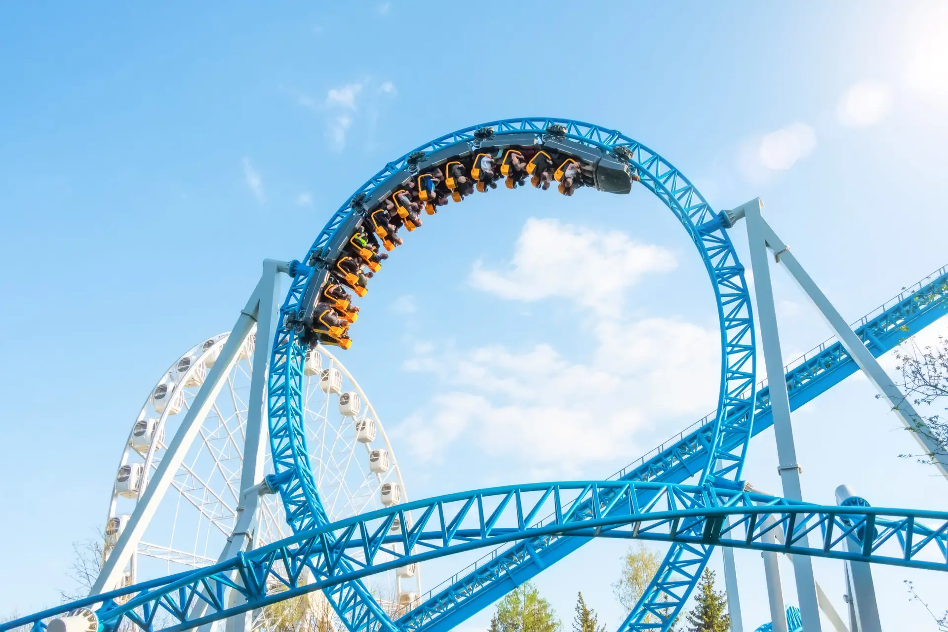 Thrilling roller coaster upside down in loop