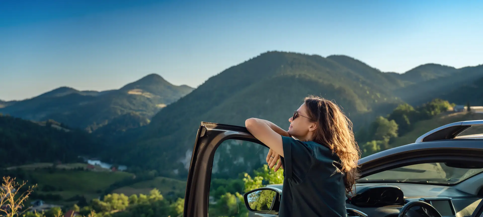 Beautiful traveler enjoying a summer road trip