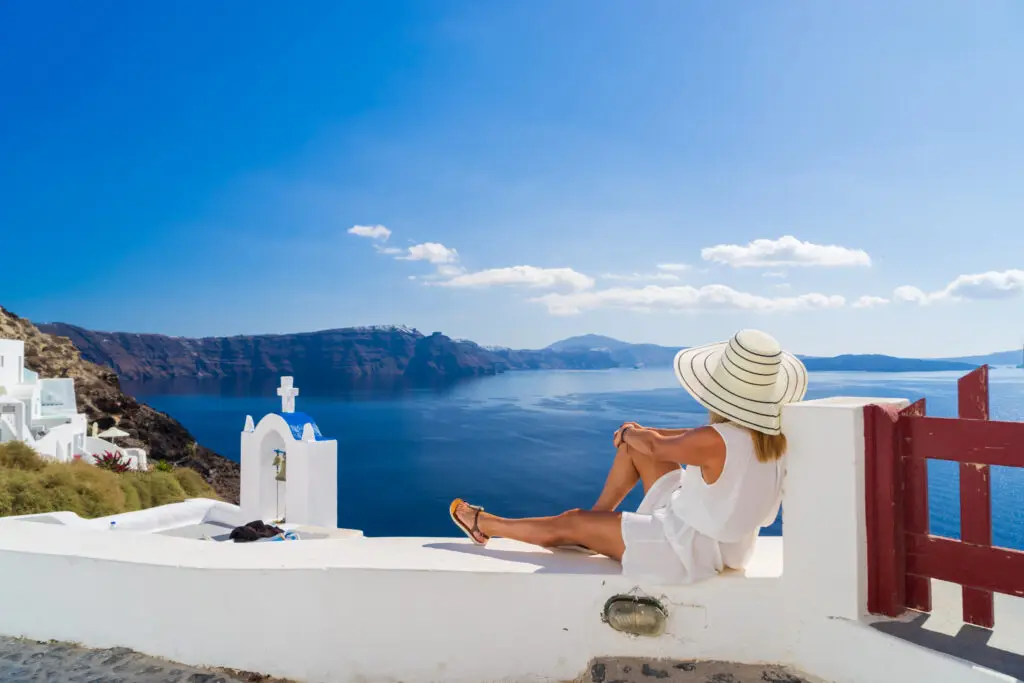 women on a solo vacation in Santorini Greece