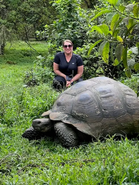 Tiffany Dent with a tortoise experience during a trip