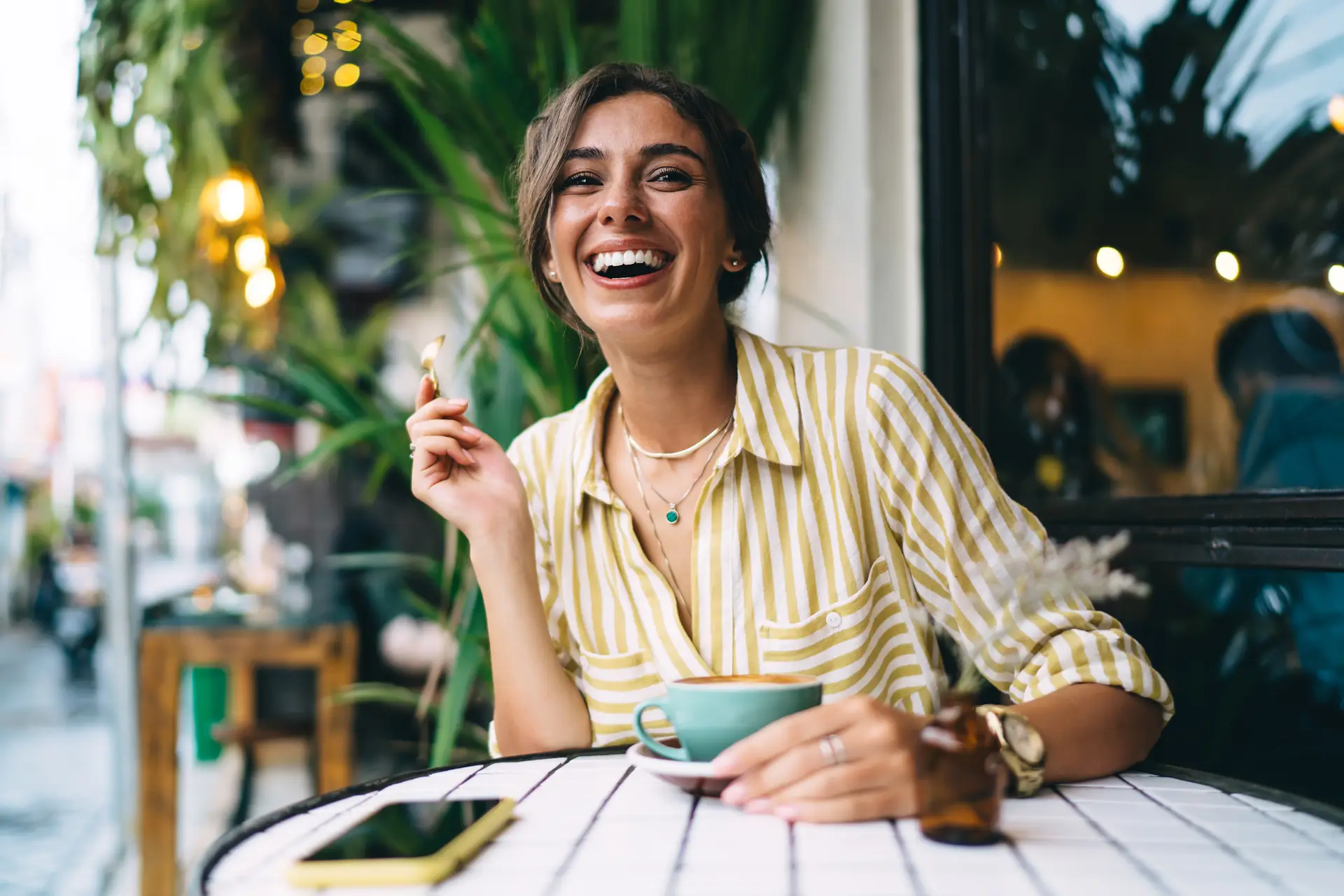 woman having coffee at cafe solo traveling