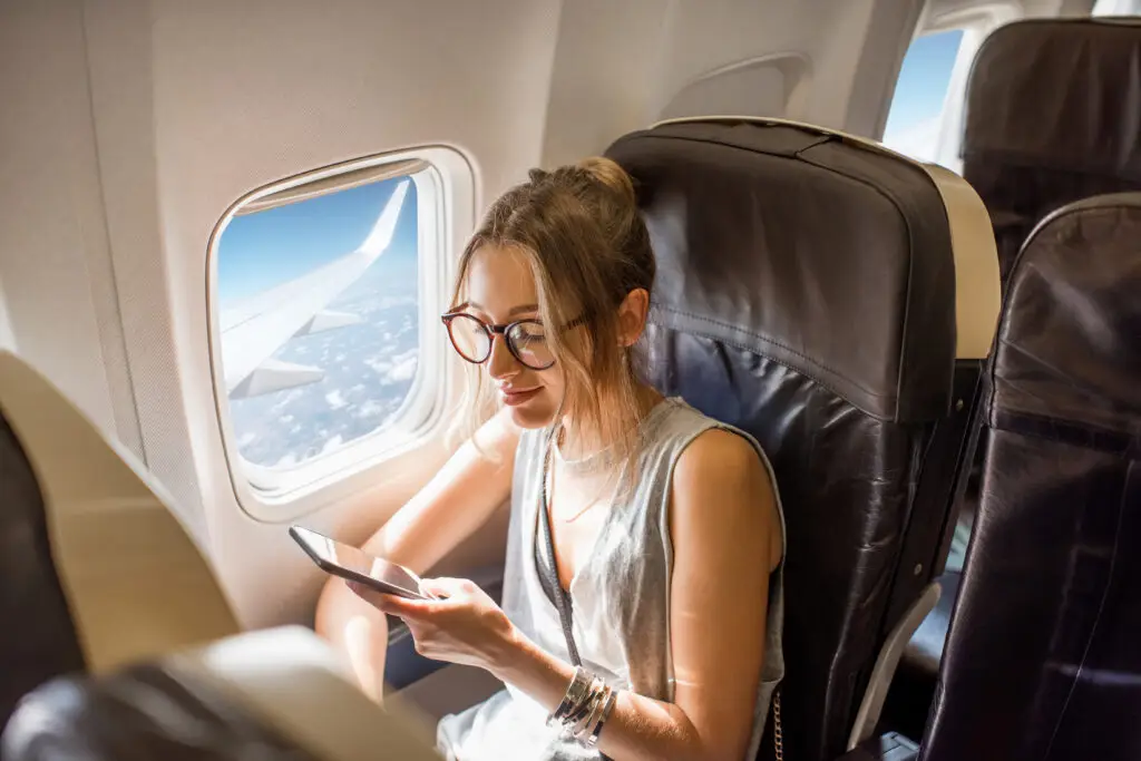 women traveling sitting on the airplane