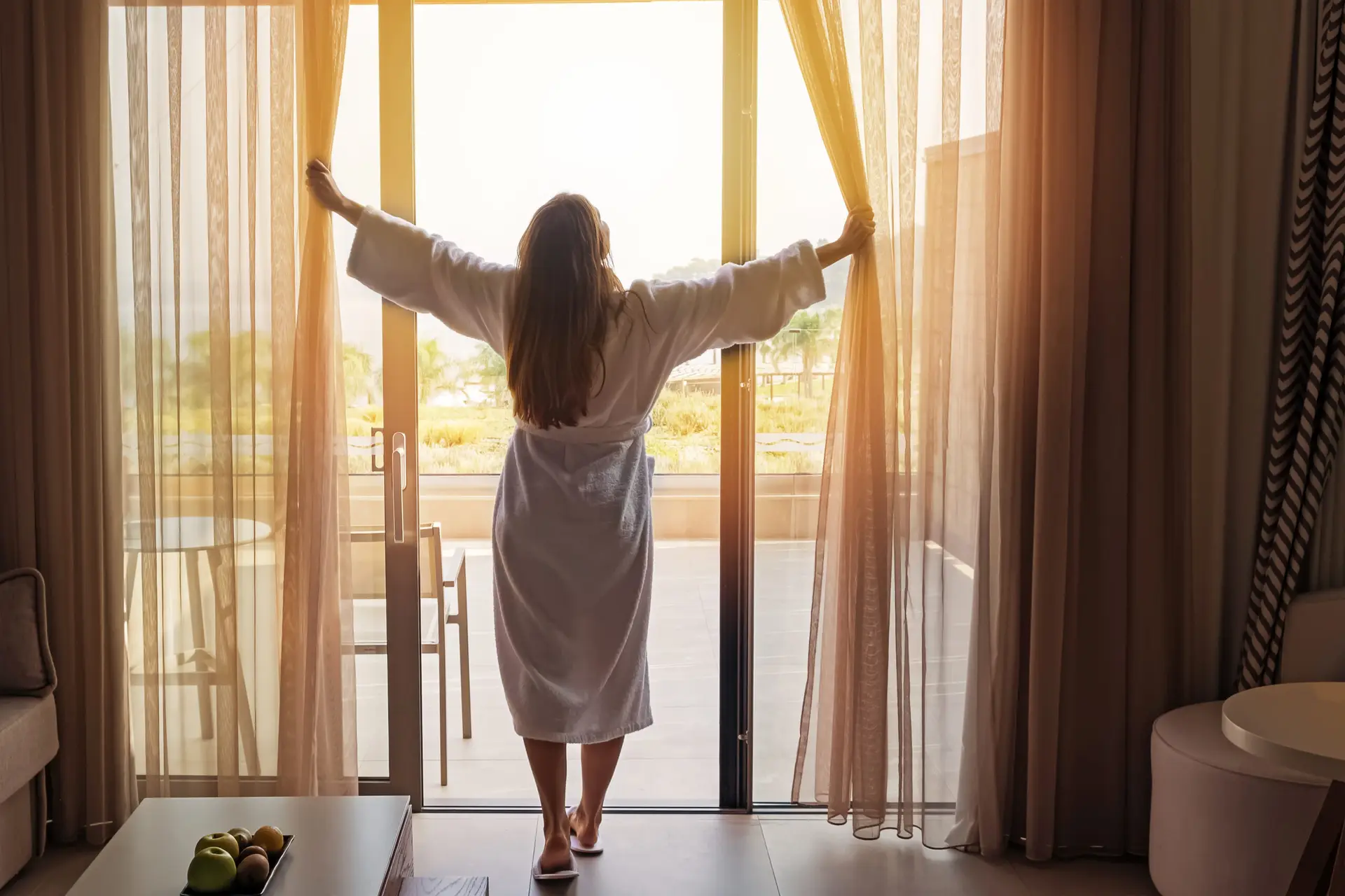 women feeling refreshed in her hotel room